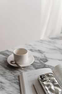 Kaboompics - Coffee in a cup - Calendar - Arabescato marble - Metal spoon - Silver iPhone Case