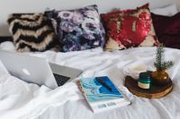 Kaboompics - Bed full of pillows and notebooks with Apple gadgets