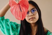 A Beautiful Young Mixed Race Girl with Anthurium Flower