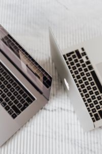 Two laptops on marble