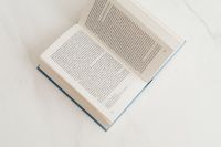 Kaboompics - Open book on marble table