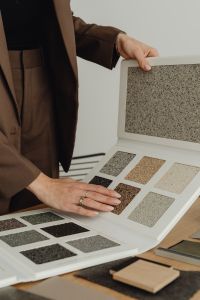 Kaboompics - Female architect reviews plaster samples - interior design