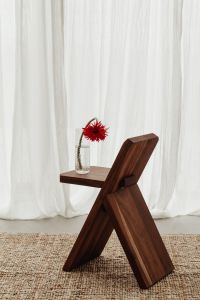 Blooming Flower in Vase on Wooden Chair - A Charming Still Life Collection