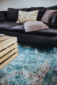 Kaboompics - Designer living room interior with a wooden box table and a light blue carpet