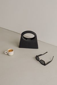 Kaboompics - Minimalist Fashion Accessories – Black Bag and Sunglasses - Coffee