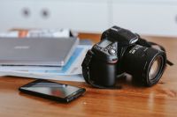 Kaboompics - Silver laptop, a black camera and a smartphone