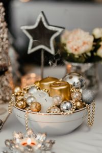 Christmas decorations and candles in gold and silver tones