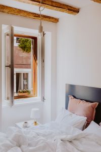 Kaboompics - White bedroom interior with window, coffee and small lamp on side table