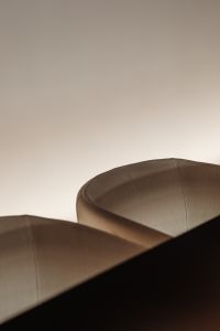 Close-up of soft fabric armchairs in gentle lighting