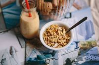Kaboompics - Jar full of walnuts with a fresh healthy shake and musli in a bowl