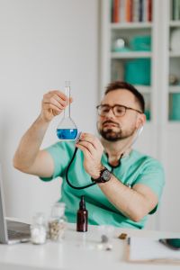 Kaboompics - Doctor with stethoscope & test tube In His Office