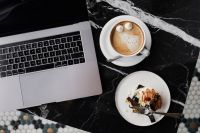 Kaboompics - Coffee and Cake with Laptop on Marble Table – Cozy Workspace Background