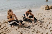Kaboompics - Women sitting on the beach