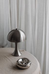 Metal desk lamp Zara Home - Silver Jewelry - Linen Tablecloth - Books