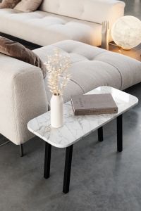 Kaboompics - Marble table - books - light beige sofa - boucle - Padova - Davide Groppi