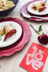 Kaboompics - Fancy dinner with seafood pasta, crayfish and red wine by the table decorated with roses