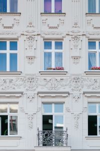 The facade of an old ornamental tenement house at Piotrkowska Street in Łódź, Poland