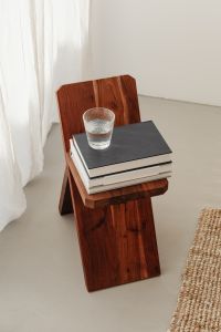 Kaboompics - Glass of water - wooden stool - books