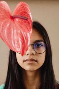 A Beautiful Young Mixed Race Girl with Anthurium Flower