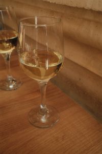 Kaboompics - Two Glasses of White Wine on a Rustic Wooden Table With a Mediterranean Touch