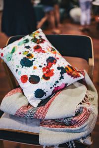 Kaboompics - Pillow with colourful dots on a chair