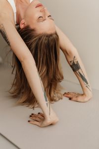 Kaboompics - Young woman practicing yoga at home