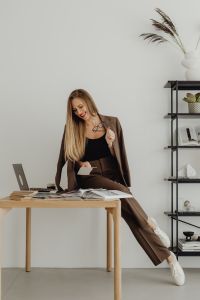 Kaboompics - Young entrepreneur dressed in brown suit - desk - laptop - computer