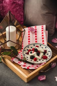 Summer berries with a sweet dessert on a plate in a drawer
