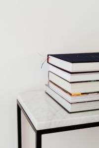 Books On Marble Table, White Background