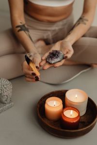 Kaboompics - Young adult woman - candles - palo Santo - crystal