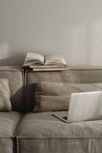 Home office on the sofa - books - notebook - organizer - planner - laptop