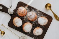 Kaboompics - Homemade doughnuts covered with powdered sugar. Traditional speciality on Fat Thursday in Poland.