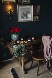 New Yorker, some nuts, watches, and other things on the old, wooden table, wreath
