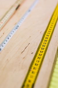 Close-ups of rulers on a wooden table