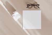 Kaboompics - Blank card & glasses on beige background