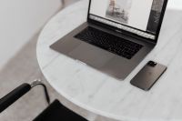 Kaboompics - MacBook Pro 15 laptop and iPhone 11 Pro on a marble table