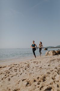 Kaboompics - Women jogging on the beach
