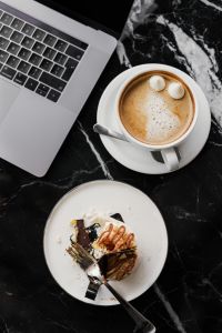 Kaboompics - Coffee and Cake with Laptop on Marble Table – Cozy Workspace Background