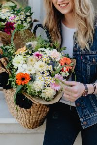 Kaboompics - Young woman with basket full of flowers