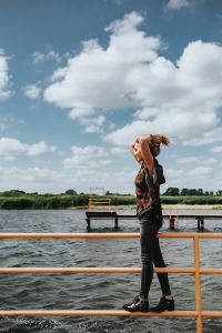 Kaboompics - Beautiful blonde woman on a wooden pier by the lake