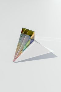 Rainbow spectrum in a glass prism with shadow
