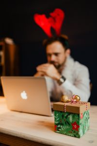 Designer sits at his desk in a holiday atmosphere