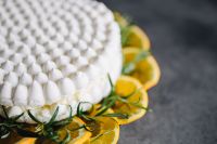 Kaboompics - Meringue Cake with whipped cream and oranges