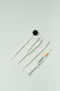 Disposable dental tools - a mirror probe, tweezers, syringe