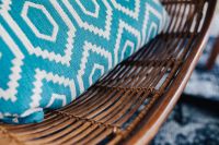 Kaboompics - Closeup of blue pillow and rattan chair