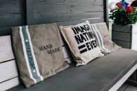 Kaboompics - Grey pillow on a bench