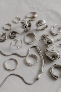 Kaboompics - Silver jewelry - rings - necklace - metal trend aesthetic