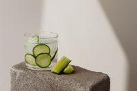 Water glass - cucumber - ice cubes