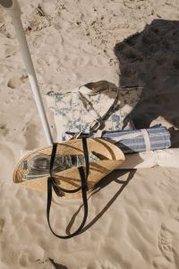 Kaboompics - Beach Umbrella and Bag on Sandy Shore