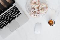Kaboompics - Macbook Laptop, donuts & coffee